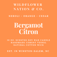 Load image into Gallery viewer, Orange square label with white text reading Wildflower Nation & Co., Neroli - Orange - Cedar, Bergamot Citron, 10 oz.