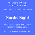 Load image into Gallery viewer, Blue and white product label for a Wildflower Nation & Co. scented soy wax candle named 'Nordic Night', with text listing Bergamot, Mahogany, and Musk notes, 10 oz.