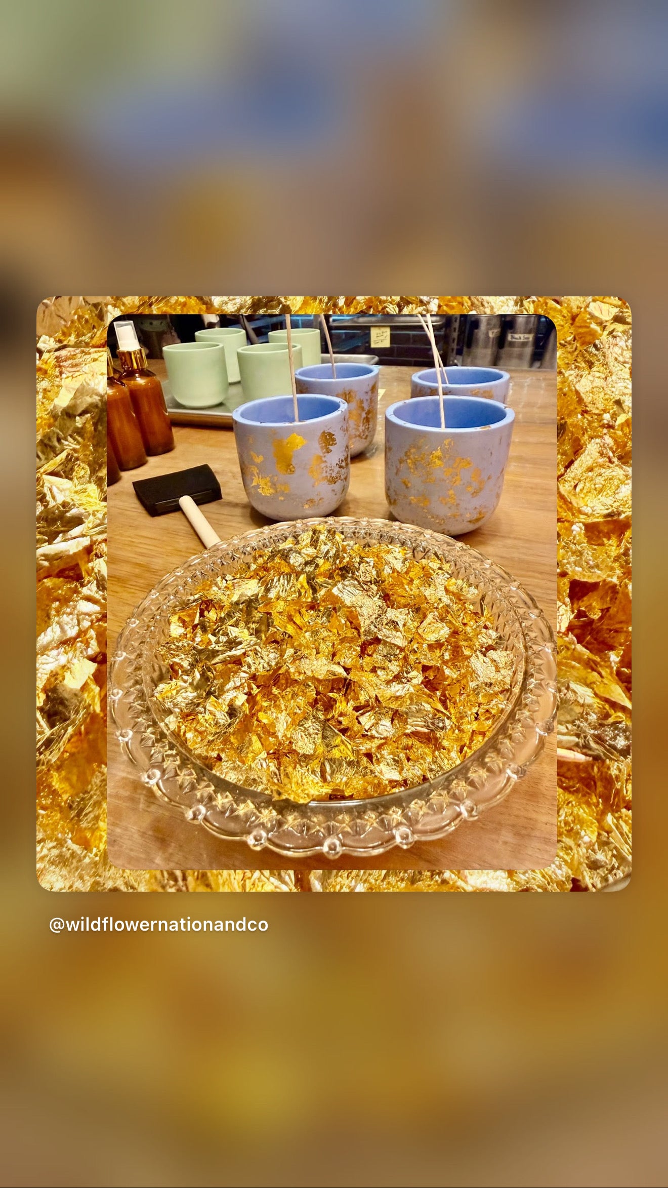 Handmade candle vessels and gold decorative flakes arranged on a worktable during the artisan candle-making process at Wildflower Nation & Co.