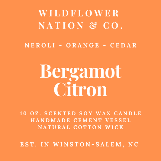 Orange square label with white text reading Wildflower Nation & Co., Neroli - Orange - Cedar, Bergamot Citron, 10 oz.