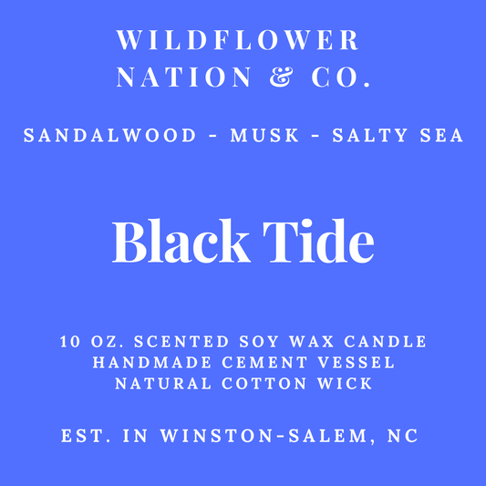 Blue and white product label for Wildflower Nation & Co. Black Tide scented soy wax candle, featuring the scent notes Sandalwood - Musk - Salty Sea and product details in white text.